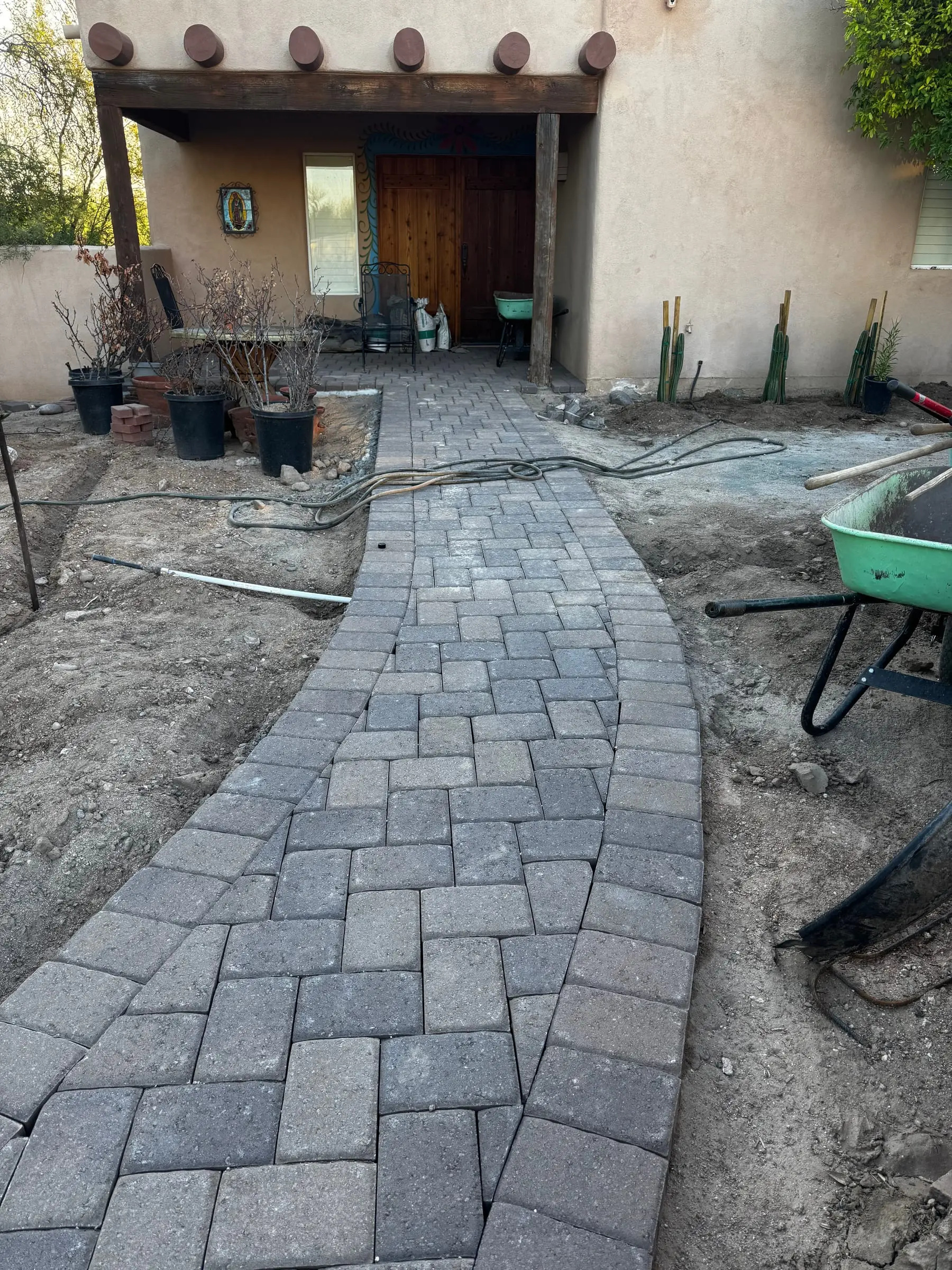 Paver path leading to a covered patio, with the borders still being finished, east Tucson, AZ.