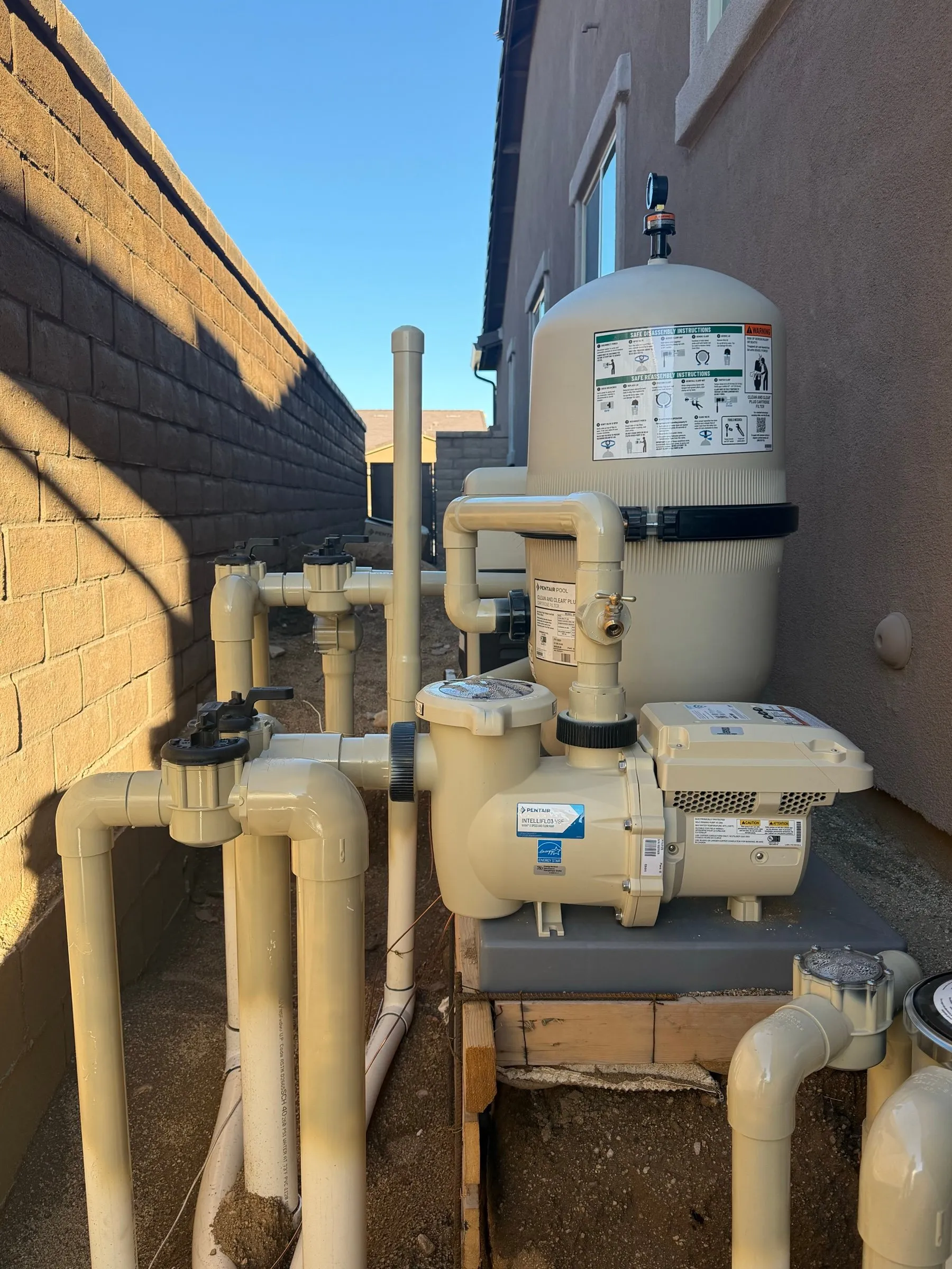 Pentair IntelliFlo3 variable-speed pump and Clean & Clear Plus cartridge filter on a new equipment pad in a Marana side yard.