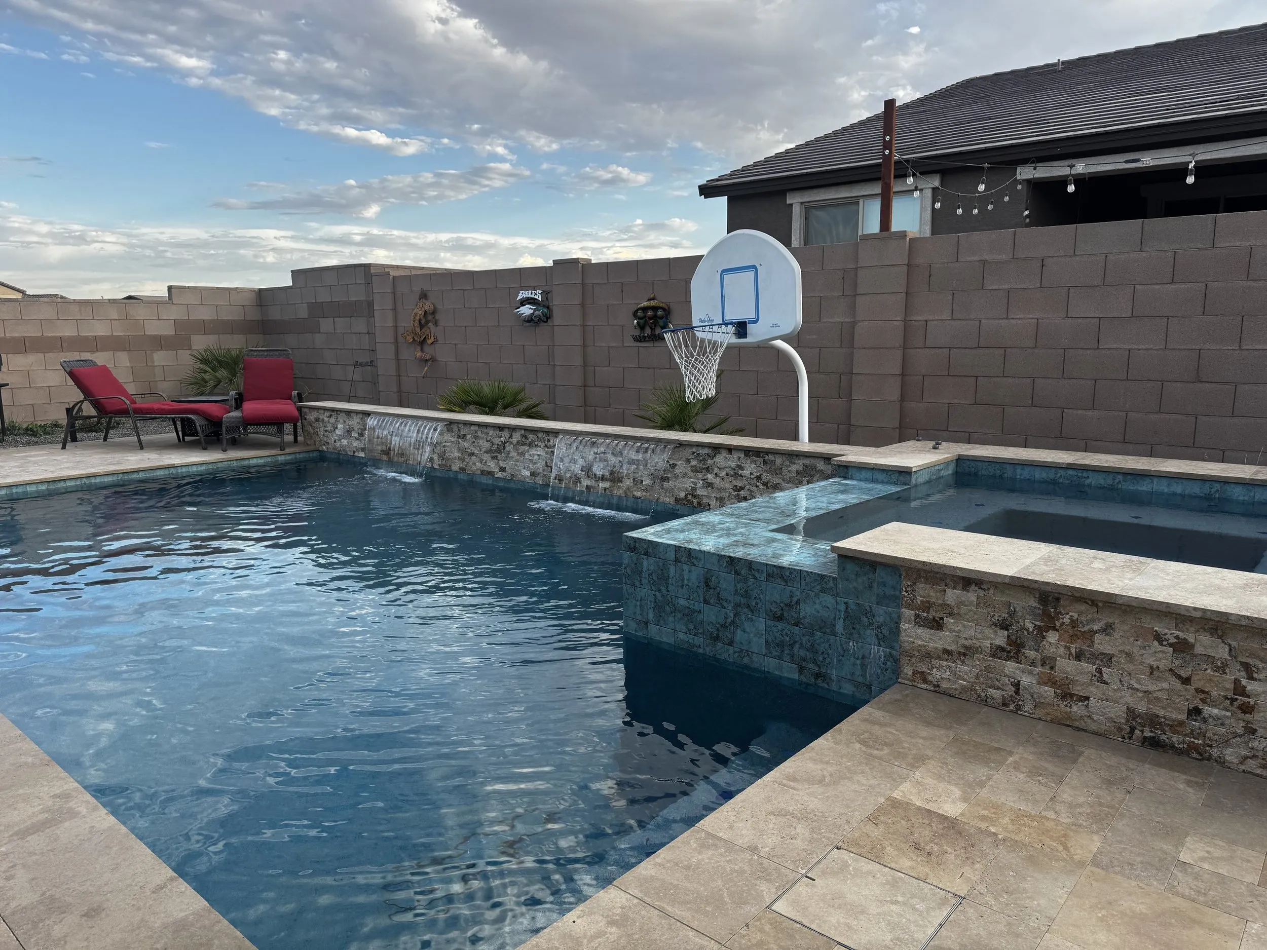 Pool and spa with a built-in BBQ outdoor kitchen