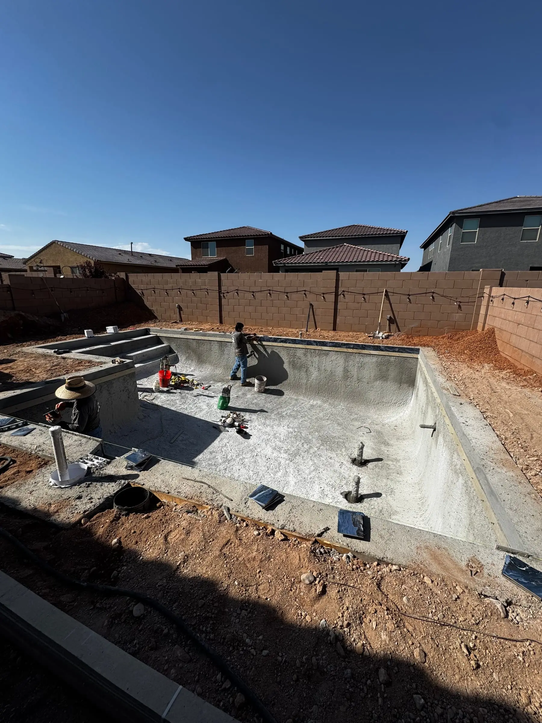 Rectangular pool shell with entry steps as our crew preps the interior, southeast Tucson, AZ.